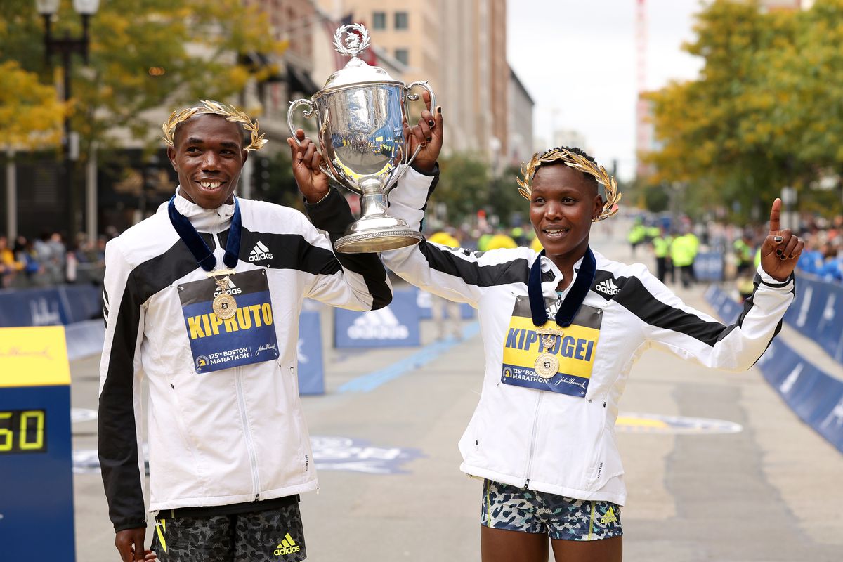 Benson Kipruto and Diana Kipyogei of Kenya react after winning the men’s and women’s divisions of the 125th Boston Marathon on October 11, 2021 in Boston, Massachusetts.