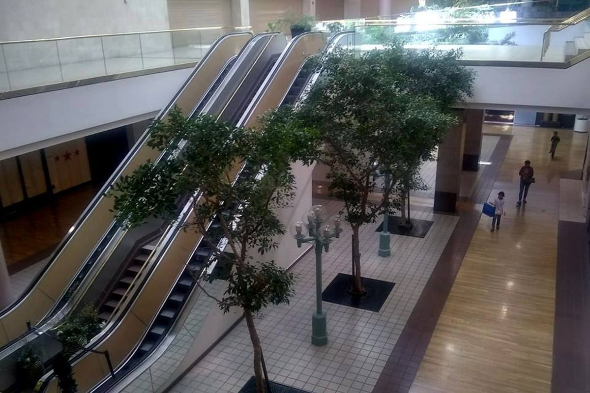 Empty escalators and shops at Vallco mall.