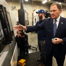 Gov. Gary Herbert looks at an Okuma computer numerical control turning center after announcing his $16.7 billion budget proposal at the Barlow Building at the Davis Applied Technology Center in Kaysville on Wednesday, Dec. 13, 2017. Herbert declared 2018 as the “Year of Technical Education.”