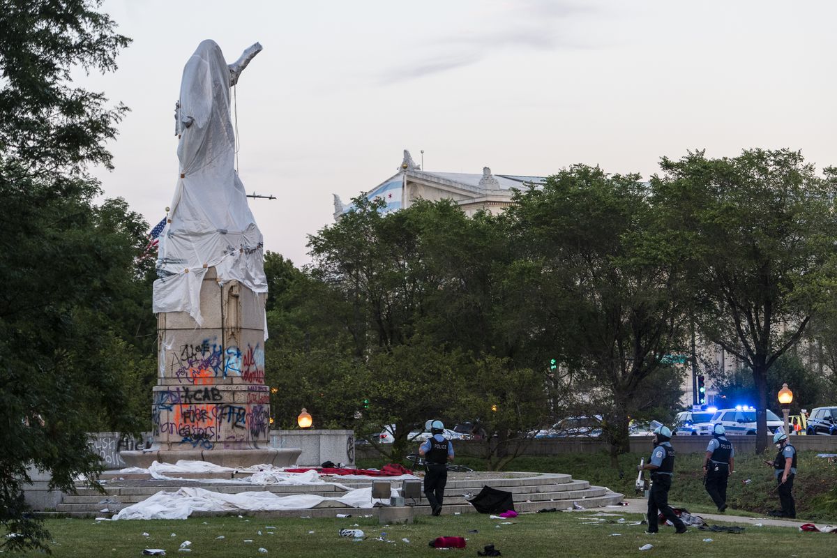 In July, police officers stood guard at the site of the Christopher Columbus statue at Roosevelt Road and Columbus Drive after protesters tried to topple it. The city later removed it after and put it in storage.