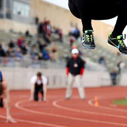 A competitor warms up before competing in the 400 meters. dash at the Davis Super Meet at Davis High School in Kaysville Wednesday, March 23, 2016.