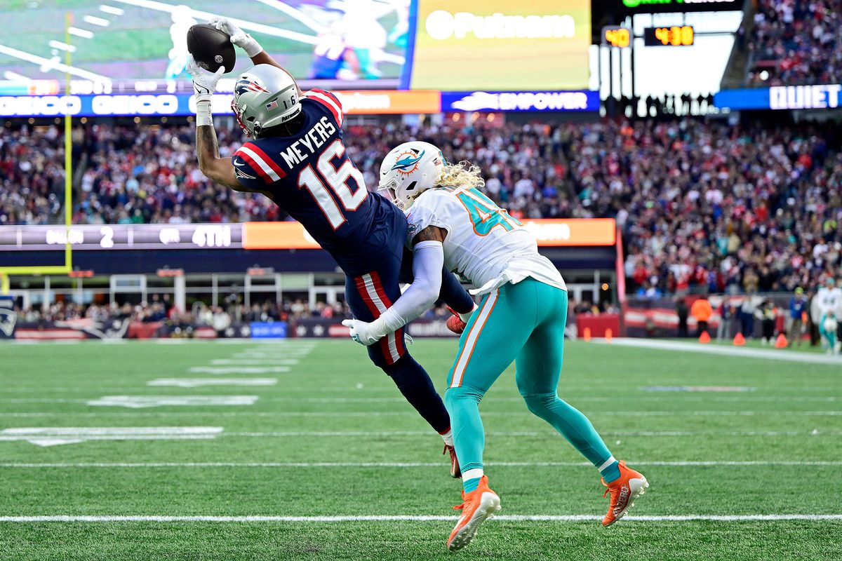 Jakobi Meyers #16 of the New England Patriots catches a touchdown pass against Duke Riley #45 of the Miami Dolphins during the fourth quarter at Gillette Stadium on January 01, 2023 in Foxborough, Massachusetts.