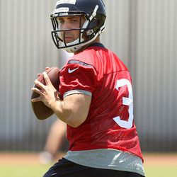 Tom Savage dropping back to pass at practice