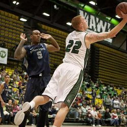 UVU forward Nick Thompson (22) pulls down a rebound in front of Utah State forward Jarred Shaw (5) during the second half of the NCAA basketball game between UVU and Utah State in the UCCU center in Orem, Saturday, Dec. 15, 2012.