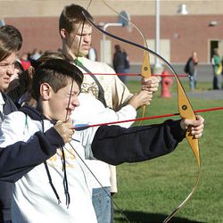 Matthew Harding from Mapleton Junior High shoots bow and arrow during Special Education Extravaganza.