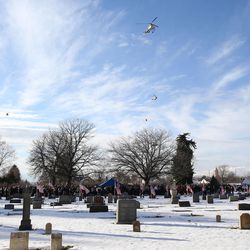 An honorary "flyover" is performed during graveside services for Utah Highway Patrol trooper Eric Ellsworth at the Brigham City Cemetery on Wednesday, Nov. 30, 2016. Trooper Ellsworth died Tuesday, Nov. 22, four days after he was hit by a 16-year-old driver while attempting to slow traffic in Garland because of a problem with a power line.