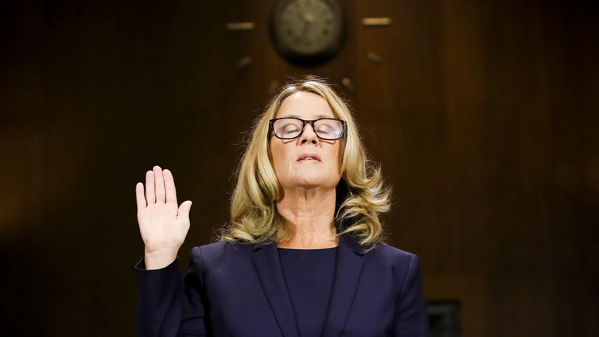 Christine Blasey Ford is sworn in before testifying in front of the Senate Judiciary Committee on September 27, 2018.
