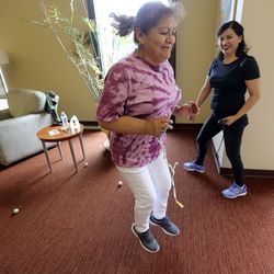 Reyna Whitney trying to empty a box of balls that is tied to her back during the Junk in the Trunk event during the ninth annual Salt Lake County Senior Wellness Decathlon at the Magna Kennecott Senior Center in Magna on Tuesday, Sept. 17, 2019.