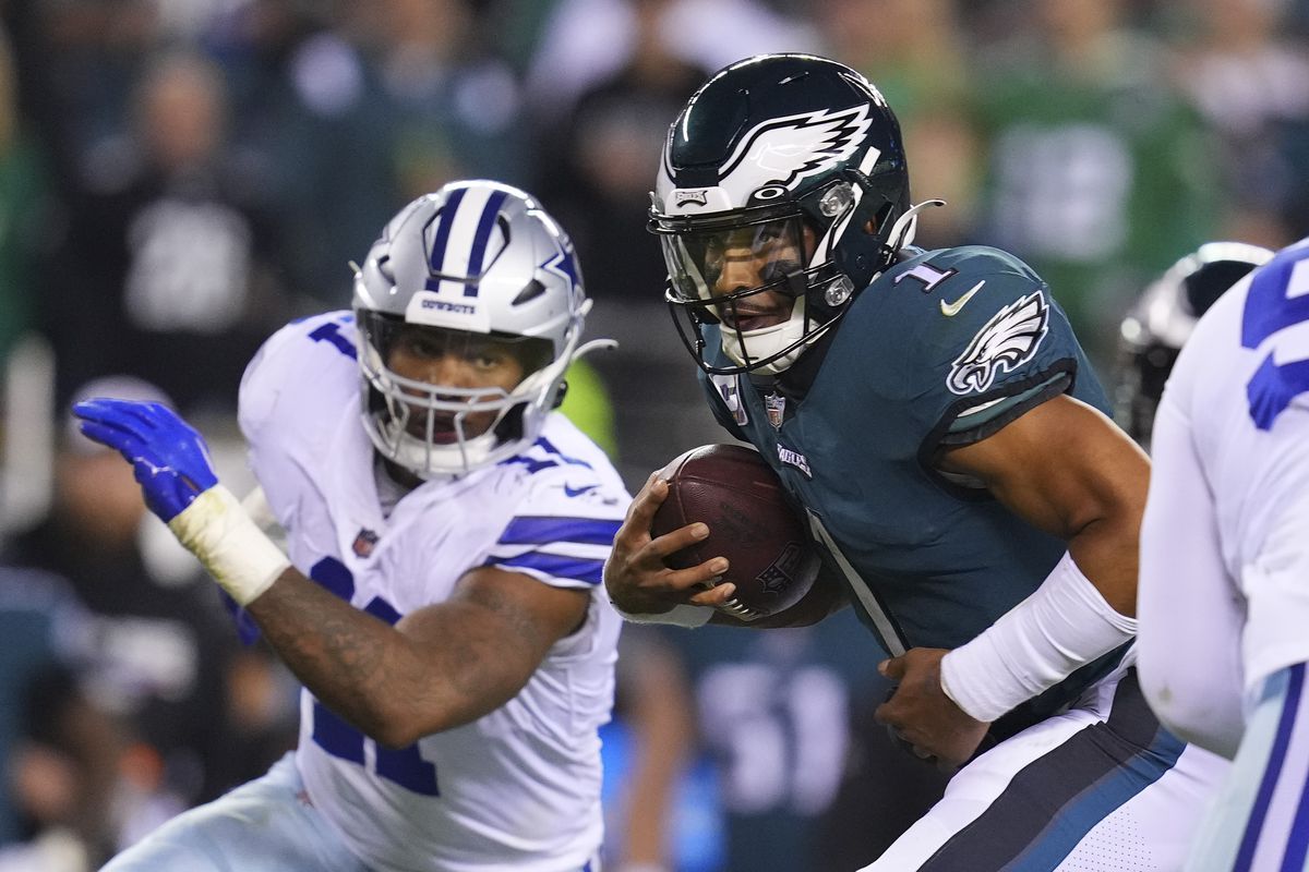 Jalen Hurts #1 of the Philadelphia Eagles runs the ball against Micah Parsons #11 of the Dallas Cowboys at Lincoln Financial Field on October 16, 2022 in Philadelphia, Pennsylvania.