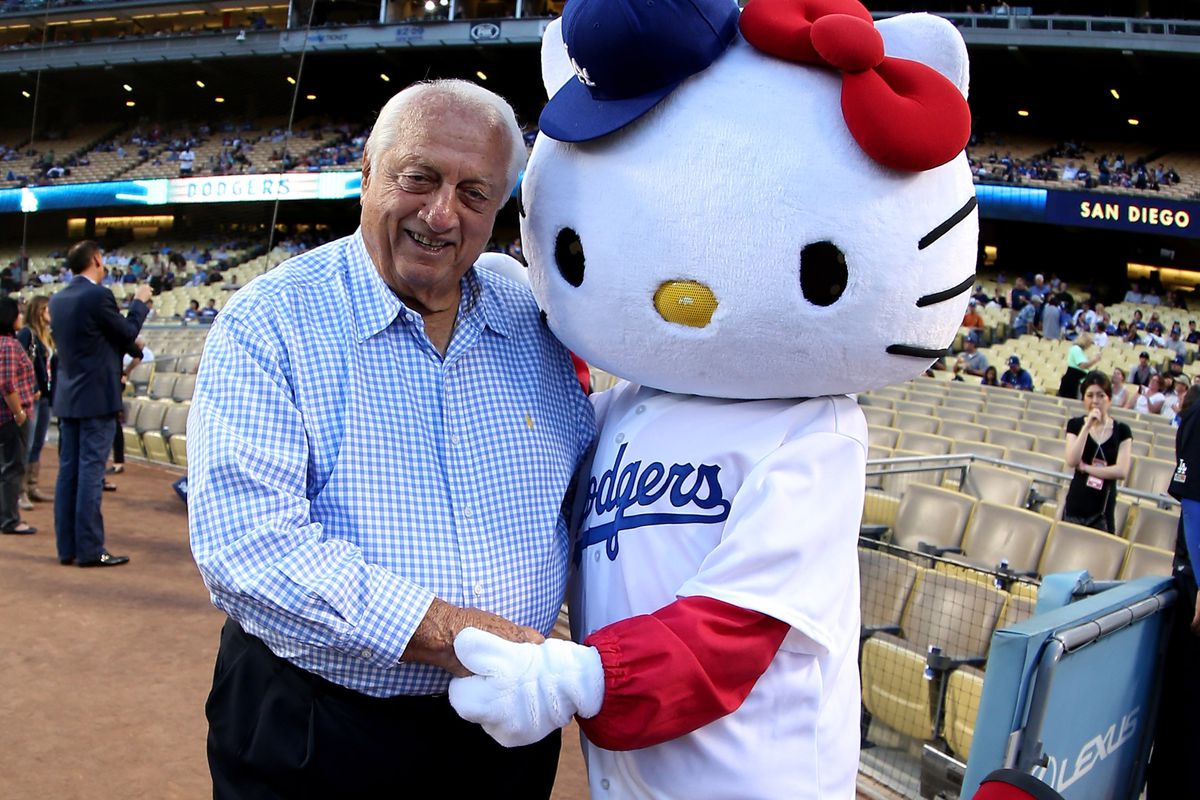 Hello Kitty, clearly a cat, poses with Tommy Lasorda before a Dodgers game in 2011.