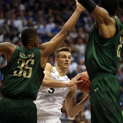Brigham Young Cougars guard Kyle Collinsworth (5) looks for a teammate to pass to during the first round of the NIT versus the UAB Blazers at the Marriott Center in Provo, Wednesday, March 16, 2016.