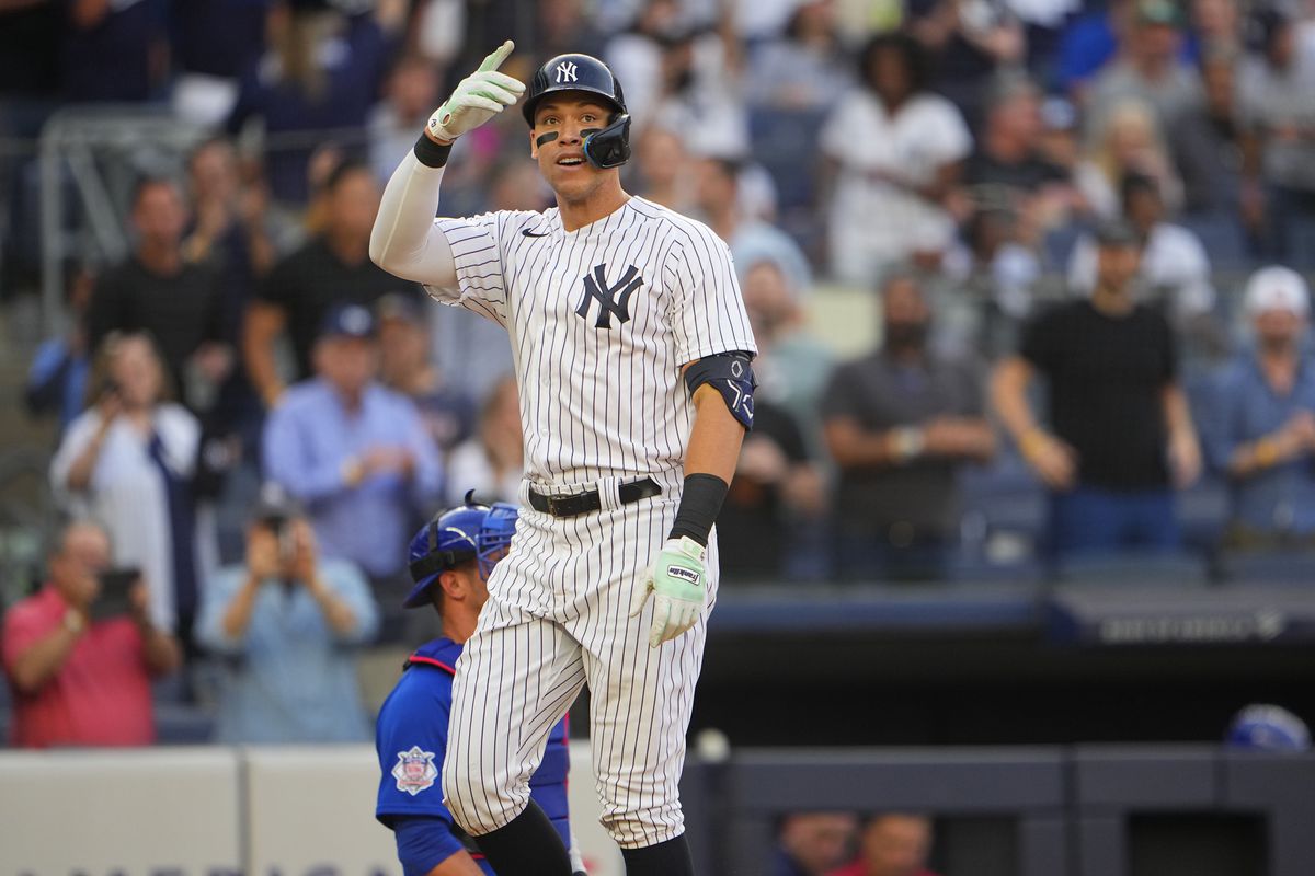 New York Yankees designated hitter Aaron Judge (99) reacts after hitting a home run against the Chicago Cubs during the first inning at Yankee Stadium.