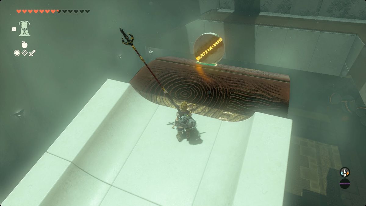 The Legend of Zelda: Tears of the Kingdom Link waiting for the spinning wheel to deliver a ball to him in Zanmik Shrine