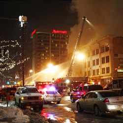 Firefighters battle a fire at Club DV8 in Salt Lake City. 