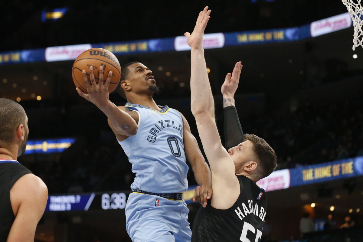 Memphis Grizzlies guard De’Anthony Melton (0) shoots as Los Angeles Clippers center-forward Isaiah Hartenstein (55) defends during the first half at FedExForum.