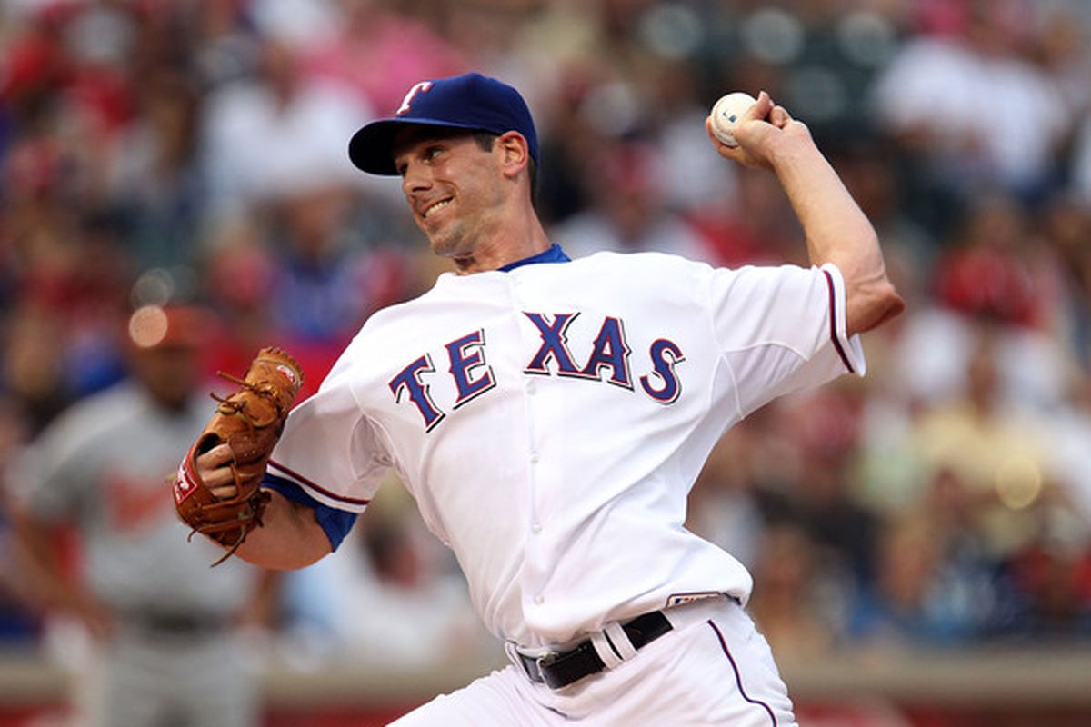 ARLINGTON TX - JULY 10:  Pitcher Cliff Lee #33 of the Texas Rangers throws against the Baltimore Orioles on July 10 2010 at Rangers Ballpark in Arlington Texas.  (Photo by Ronald Martinez/Getty Images)