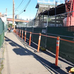 9/9, 5:18 p.m. The north side of the Waveland sidewalk reopened, between the temporary fences and barricades - 