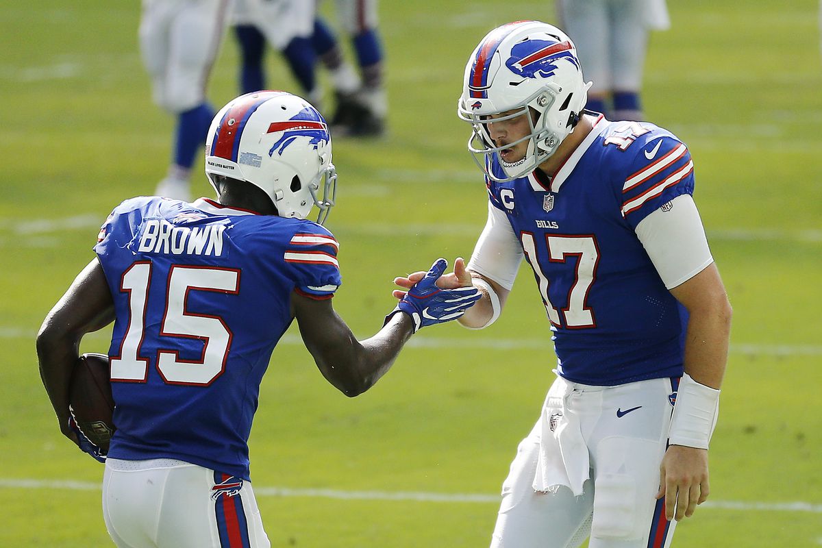 Josh Allen #17 of the Buffalo Bills celebrates with John Brown #15 after a 46-yard touchdown during the fourth quarter at Hard Rock Stadium on September 20, 2020 in Miami Gardens, Florida.