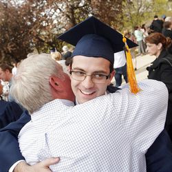 Brigham Young University student Heath Sergeant hugs family after the April 2013 Commencement ceremonies in Provo Thursday, April 25, 2013.