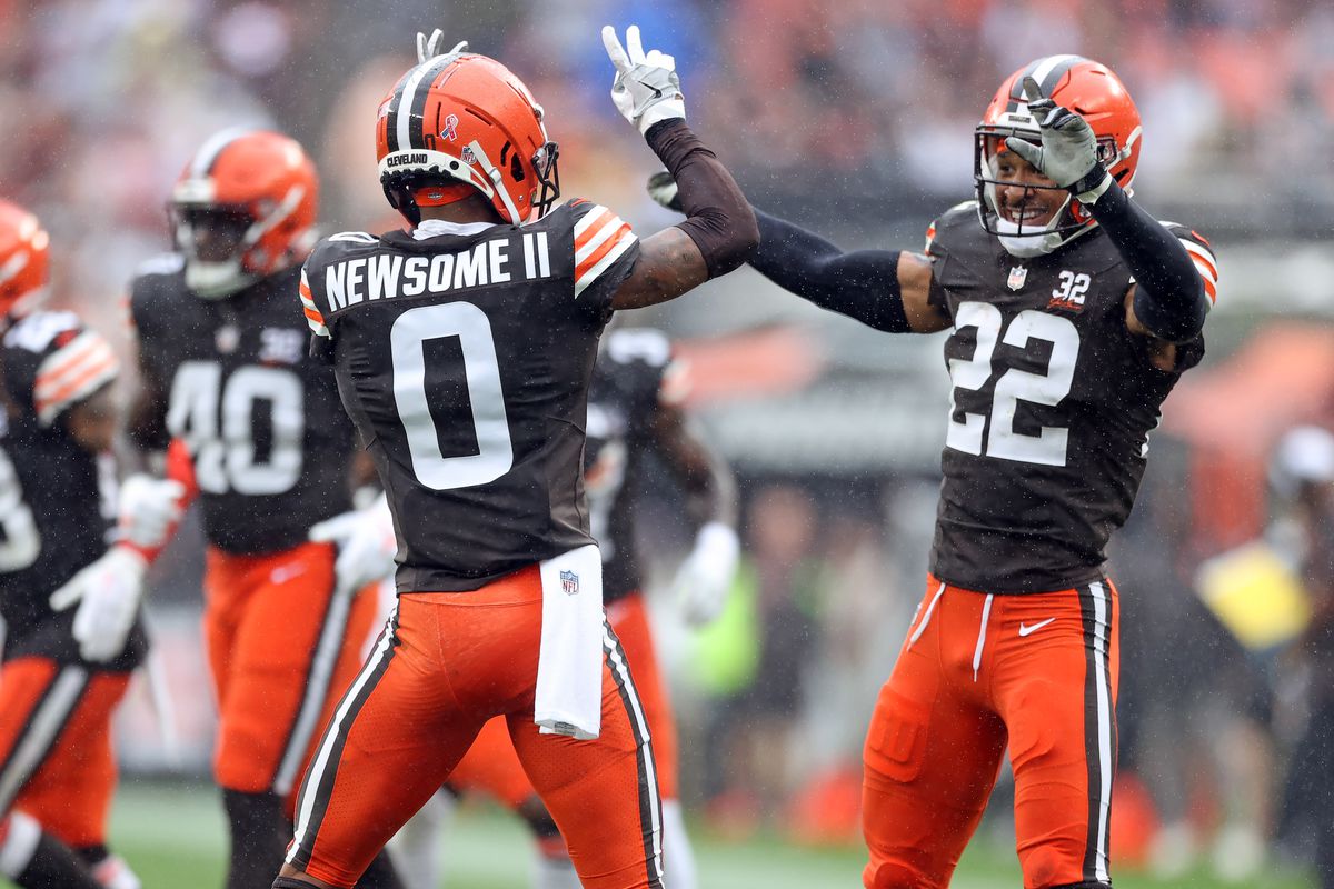 Cleveland Browns cornerback Greg Newsome II celebrates a play with safety Grant Delpit. 