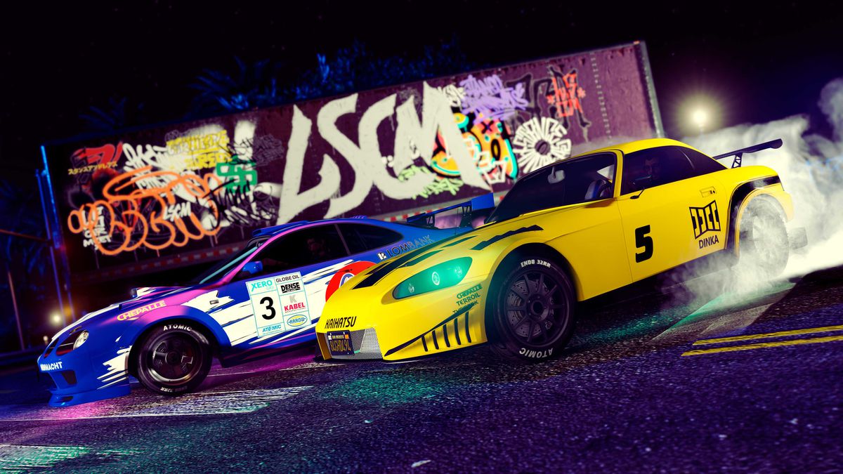 GTA Online - two sports cars rev up, ready for an underground race, against a wall of vibrant graffiti