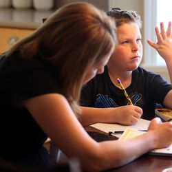 Kristin Eberting helps her son Nathan with his math homework at their home in Alpine on Thursday, Oct. 3, 2013. Nathan has dyslexia.