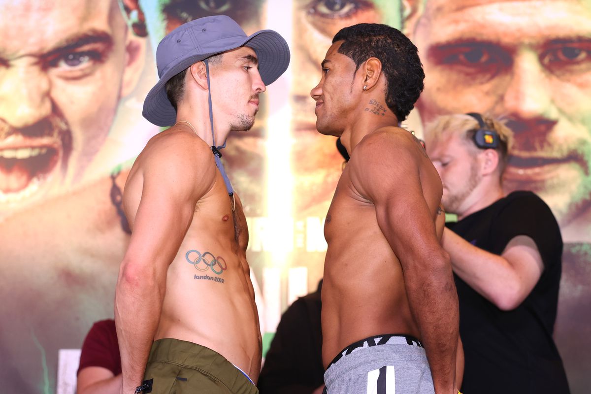 Michael Conlan (L) and Miguel Marriaga (R) face-off during the weigh in ahead of their featherweight fight at Europa Hotel on August 05, 2022 in Belfast, Northern Ireland.