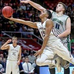 Lone Peak's Frank Jackson shoots past Copper Hills' Porter Hawkins as Lone Peak  High School and Copper Hills High School play in the 5A State Boys Basketball State Tournament quarterfinals Thursday, March 3, 2016, in Salt Lake City.