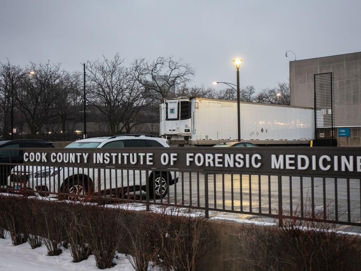 Trailers intended to store bodies amid a COVID-19 surge are parked outside the Cook County Institute of Forensic Medicine earlier this month.