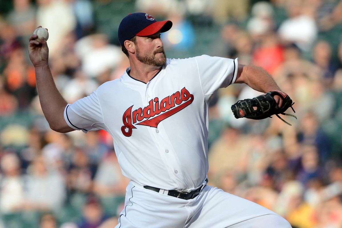 July 20, 2012; Cleveland, OH USA: Cleveland Indians starting pitcher Derek Lowe (26) throws a pitch in the first inning against the Baltimore Orioles during the game at Progressive Field.  Mandatory Credit: Eric P. Mull-USPRESSWIRE
