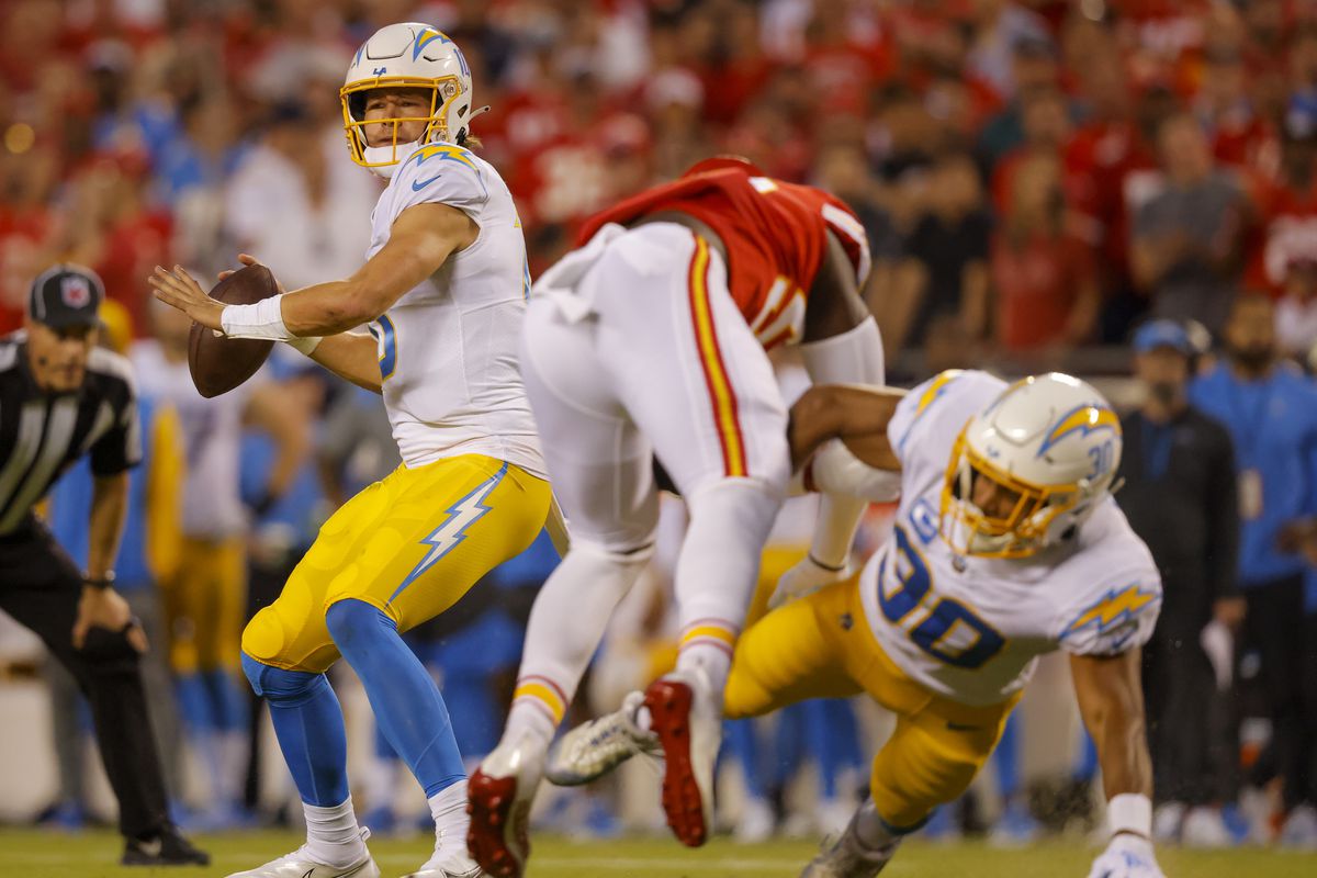 Justin Herbert #10 of the Los Angeles Chargers passes the football during the first quarter against the Kansas City Chiefs at Arrowhead Stadium on September 15, 2022 in Kansas City, Missouri.