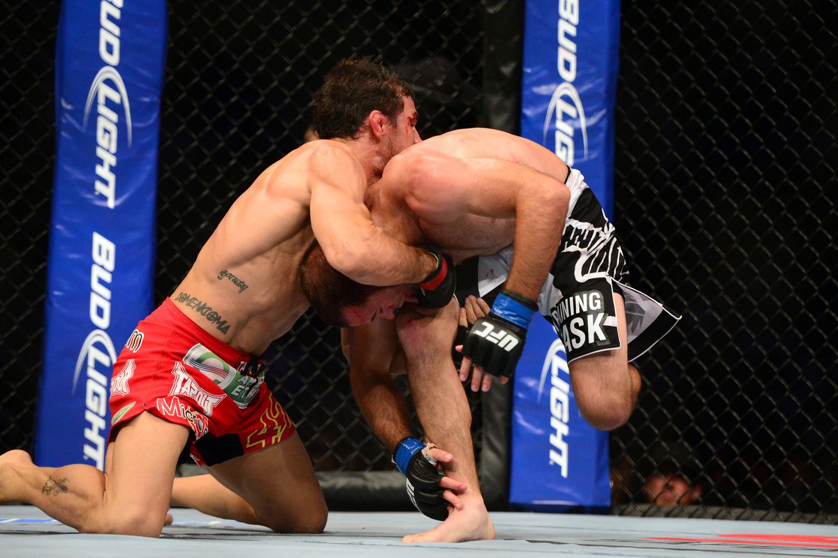 July 11, 2012; San Jose, CA, USA; Aaron Simpson (left) fights Kenny Robertson (right) during the welterweight bout of the UFC on Fuel TV at HP Pavilion. Mandatory Credit: Kyle Terada-US PRESSWIRE