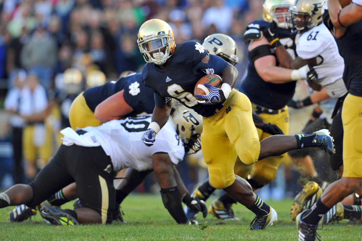 Sep 8, 2012; South Bend, IN, USA; Notre Dame Fighting Irish running back Theo Riddick (6) runs the ball in the fourth quarter against the Purdue Boilermakers at Notre Dame Stadium. Notre Dame won 20-17. Mandatory Credit: Matt Cashore-US PRESSWIRE