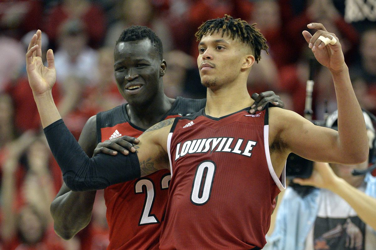 Mar 1, 2016; Louisville, KY, USA; Louisville Cardinals forward Deng Adel (22) celebrates with guard Damion Lee (0) follow the second half against the Georgia Tech Yellow Jackets at KFC Yum! Center. Louisville defeated Georgia Tech 56-53.