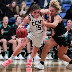 Corner Canyon's Kemery Martin moves past Farmington's Brooklyn Perkins during a 5A girls basketball quarter final game at the Lifetime Activities Center in Taylorsville on Thursday, Feb. 21, 2019.