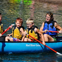 From left to right Izabel, Kaleb, Izaiah and Melissa Hinton enjoy a paddle around during the Continue Mission event in Tibble Fork in American Fork Canyon on Aug. 17, 2017.