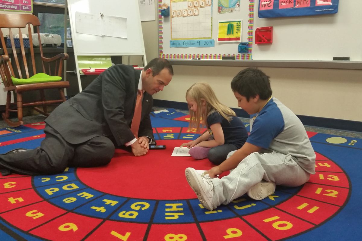 Wayne Township Superintendent Jeff Butts visits with students at Chapel Glen Elementary School in Indianapolis.