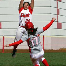 The ball is thrown high for Janeece Kapuwai of East, and Kristi DuBois of Bountiful is safe at second base during high school softball played in Salt Lake City, Friday, April 12, 2013.