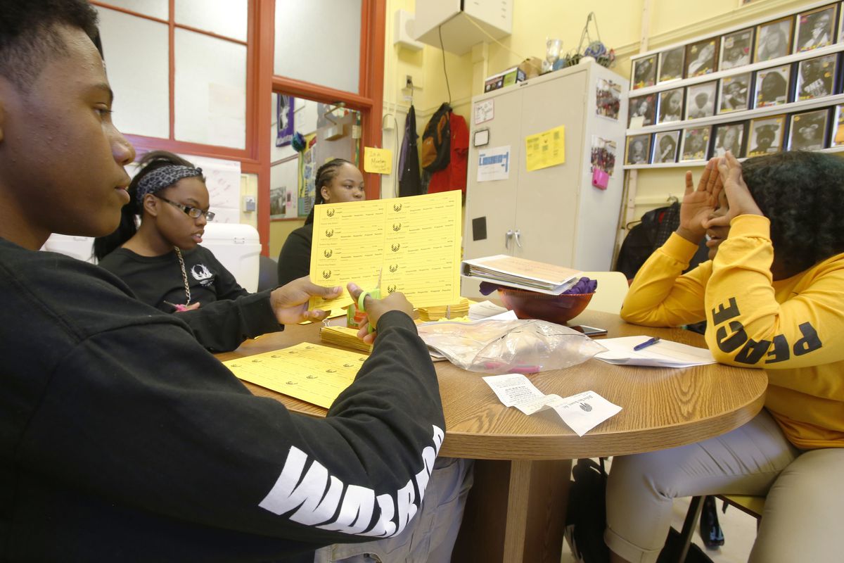 Audrey Wright (right) quizzes fellow members of the Peace Warriors group at North Lawndale College Prep High School. Wright, a junior and the group’s president, asked the students — freshmen Otto Lewellyn III (from left) and Simone Johnson and sophomore N