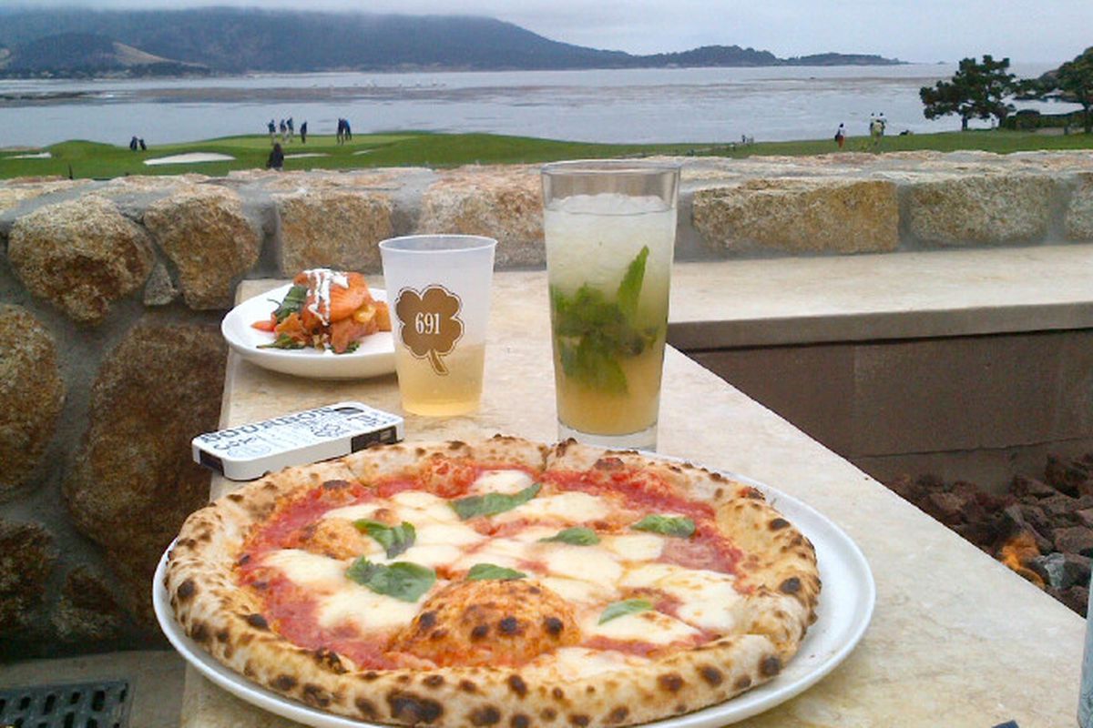 Margarita pizza with a big side of mint julep, overlooking 18th at Pebble Beach.