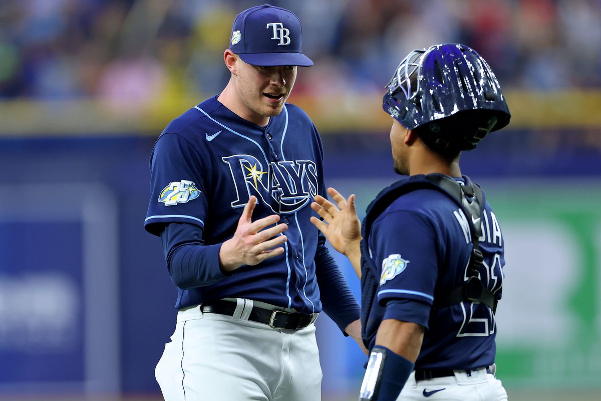 Pete Fairbanks and Francisco Mejia of the Tampa Bay Rays celebrate winning a game against the Boston Red Sox at Tropicana Field on April 12, 2023 in St Petersburg, Florida.