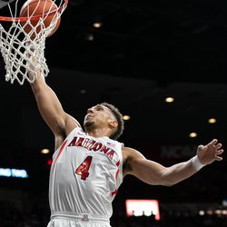 Arizona’s Chase Jeter (4) goes up for a dunk early in the Arizona-Baylor game in McKale Center on December 15 in Tucson, Ariz. Jeter finished the game with only six points on 3-for-4 shooting.