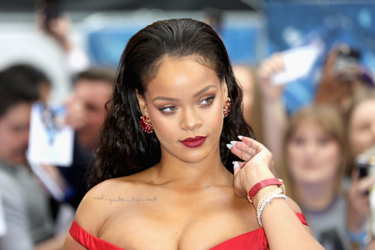 Rihanna on the red carpet in a red dress
