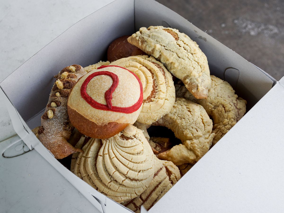 Pan dulce placed into a paper box.