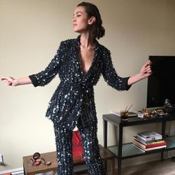 Alexa Chung in a silver. suit.