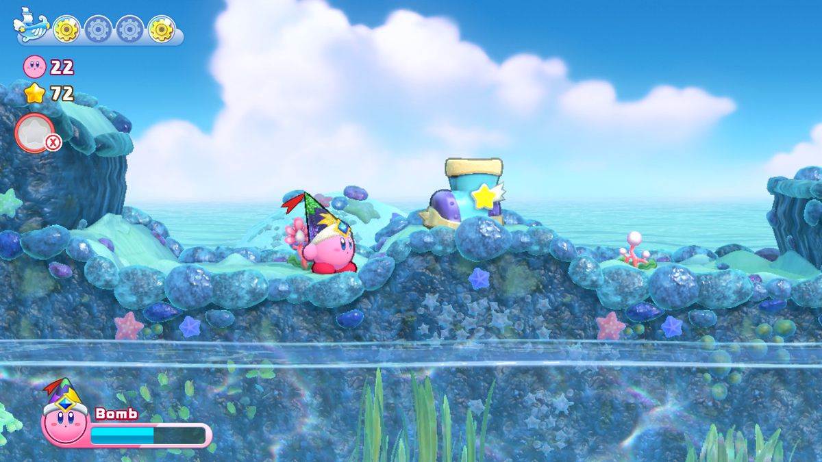 Kirby navigates the surface of a coral reef world in Kirby’s Return to Dreamland Deluxe
