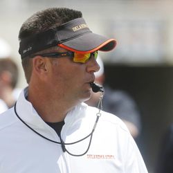Oklahoma State head coach Mike Gundy watches during the Oklahoma State spring NCAA college football game in Stillwater, Okla., Saturday, April 20, 2013. Members of Gundy's staff are attending the All-Poly camp in Layton, Utah, this weekend.