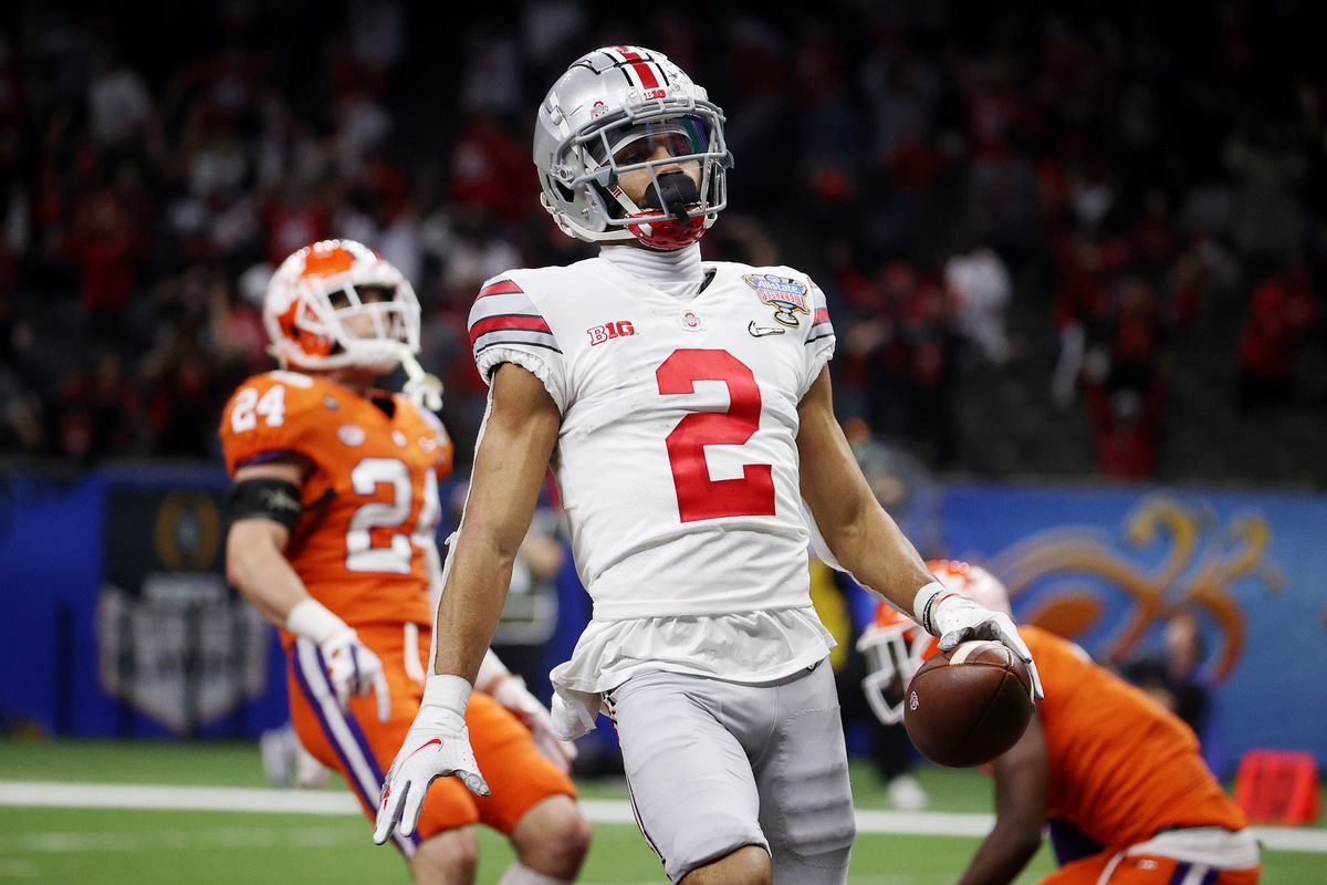 Chris Olave of the Ohio State Buckeyes reacts after his touchdown catch against the Clemson Tigers in the third quarter during the College Football Playoff semifinal game at the Allstate Sugar Bowl at Mercedes-Benz Superdome on January 01, 2021 in New Orleans, Louisiana.