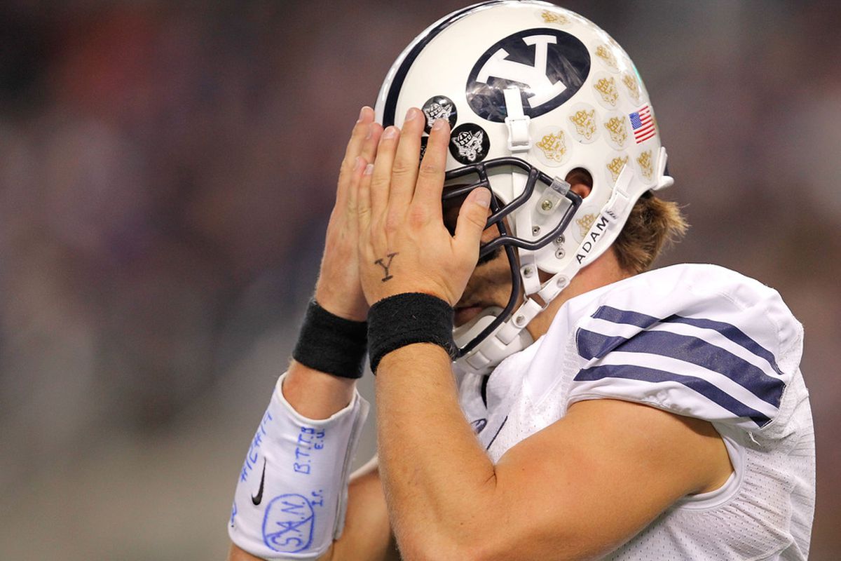 ARLINGTON, TX - OCTOBER 28:  Riley Nelson #13 of the BYU Cougars reacts after an incomplete pass during a game against the TCU Horned Frogs at Cowboys Stadium on October 28, 2011 in Arlington, Texas.  (Photo by Sarah Glenn/Getty Images)