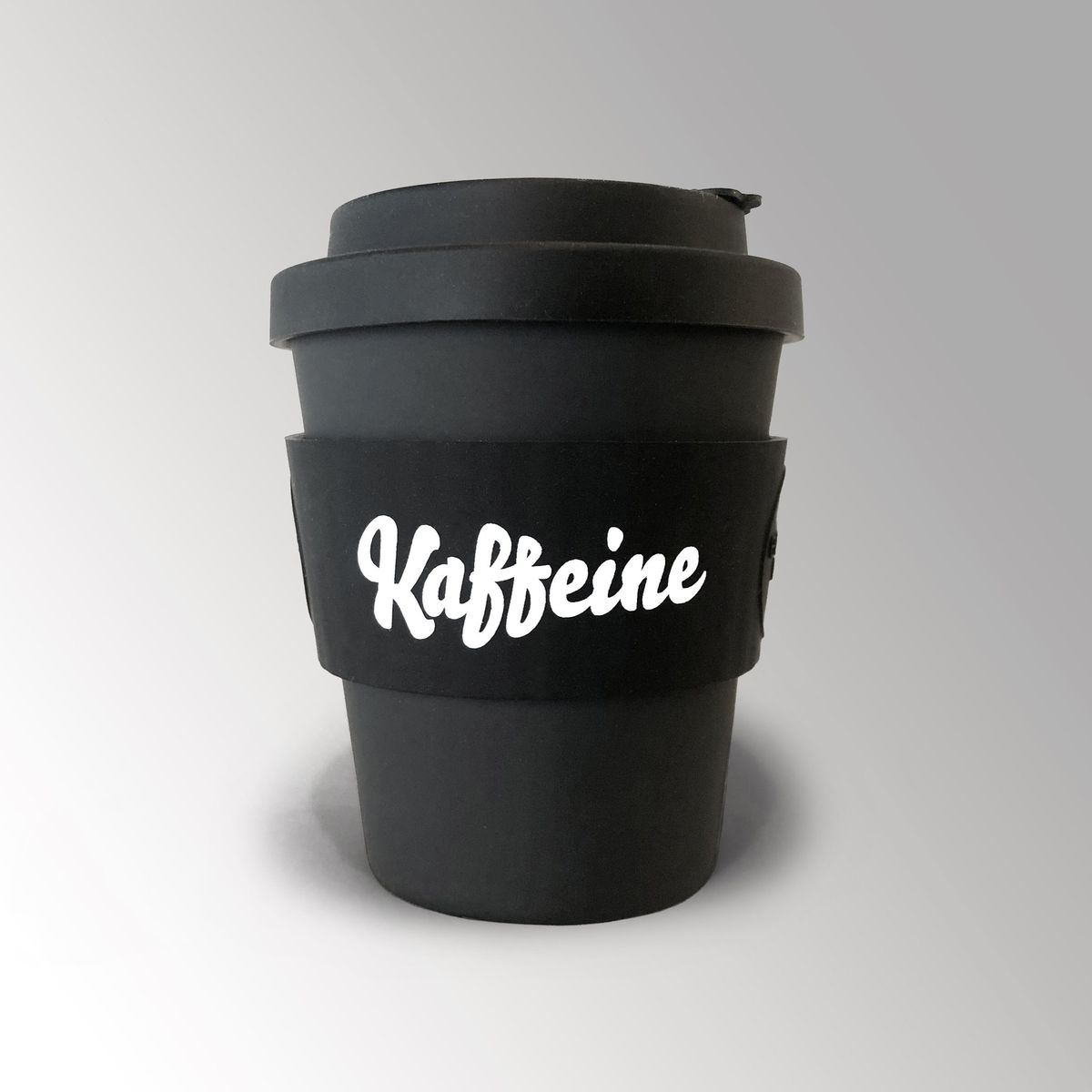 A black reusable cup with the white Kaffeine coffee shop logo